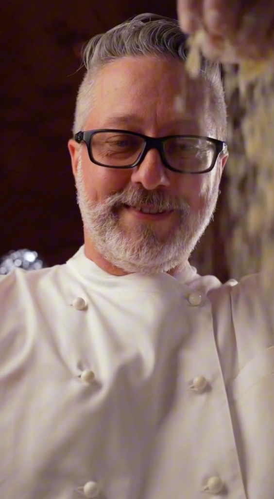 Chef Joe is preparing pizza dough to stretch