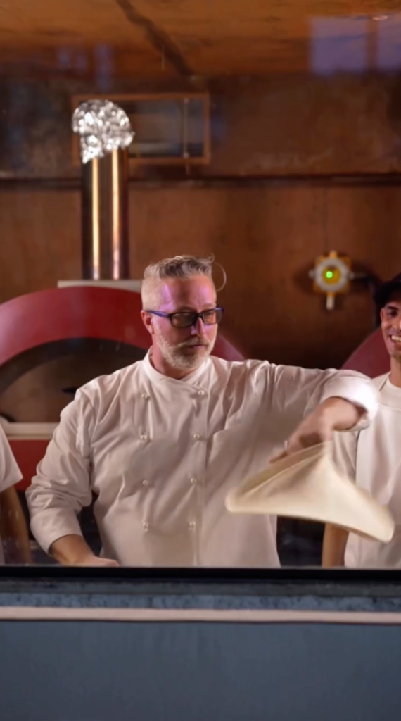 Chef Joe Stanchi in a acrobatic pizza free style